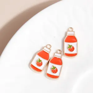 Three strawberry milk bottle charms in gold alloy for DIY jewelry making and keychains