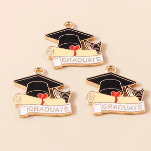 Set of 3 graduation themed alloy charms including black mortarboard and diploma roll