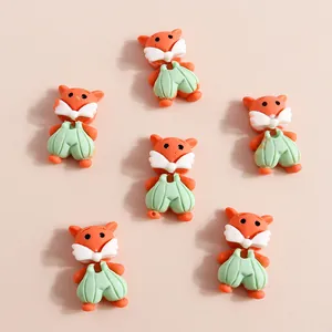 Cute resin fox figurines for DIY crafts and phone case decoration in orange and green