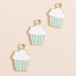 Detailed view of alloy cupcake pendants with drip oil enamel and gold-plated edges