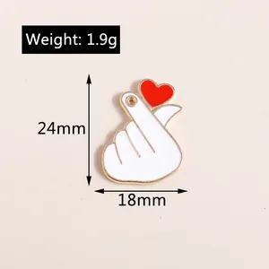 Detail view of heart gesture enamel pendant showing size dimensions and 1.9g weight