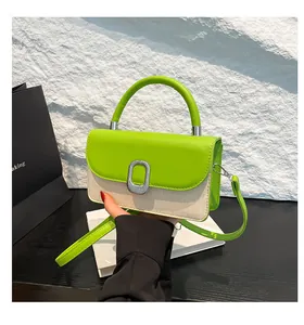Detail of lime green flap and beige woven texture with silver oval lock on handbag