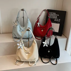 Versatile nylon tote bag in four colors with bow details and star pendant charms