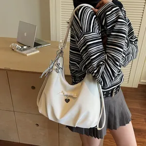 Creamy large capacity faux leather tote bag with bow detail and cute balloon dog charm