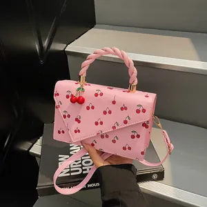 Pink cherry pattern handbag with woven handle and cherry charm crossbody bag