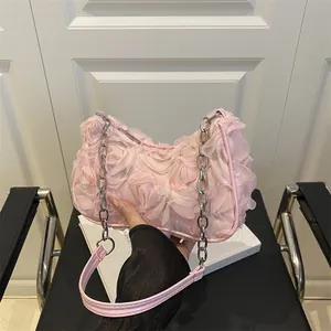 Pink floral crossbody bag with 3D petals and silver chain strap for women