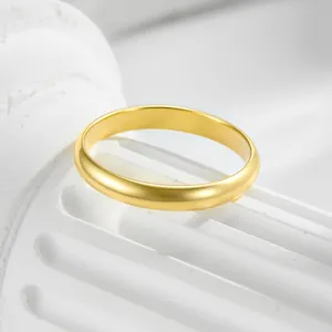Minimalist 14K gold plated s925 silver 3mm polished band ring on a white marble stand