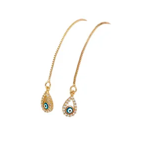 Golden Evil Eye threader earrings with blue drop pendants and sparkling crystal accents