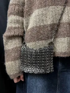 Close-up of handmade gunmetal metallic chainmesh bag showing intricate woven details
