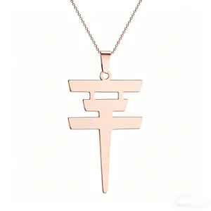 Macro detail of rose gold necklace featuring the Chinese character Ping for peace and safety