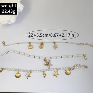 Detail of bohemian beaded anklets with gold starfish and shell pendants in macro view