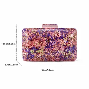 Detailed size view of an acrylic evening bag with colorful marbling and dimensions