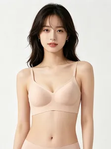 Detail of nude seamless jelly bra set with soft support and thin straps on model