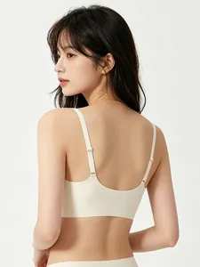 Detail of adjustable thin straps and seamless U-back design on creamy beige jelly bra