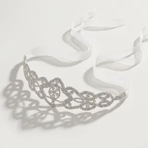 Luxury bridal headband with shimmering rhinestones and white organza ribbons for weddings