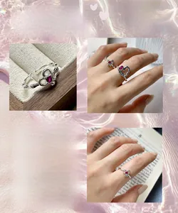 Macro detail of silver heart ring with rose red zircon and textured bamboo band