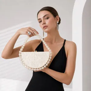 Elegant semi-circle pearlescent evening bag with luxury pearl handle and mother-of-pearl texture