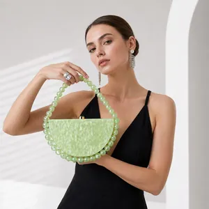 Elegant semi-circular acrylic evening bag with green marble texture and beaded handle