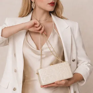 Elegant pearl acrylic box clutch with gold chain strap for evening beach wedding parties