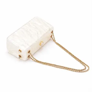 Acrylic evening bag with marble texture and golden metal chain for summer beach parties