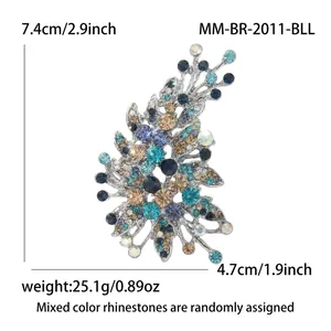 Detail of irregular glass brooch with dimensions 7.4x4.7cm and colorful rhinestones