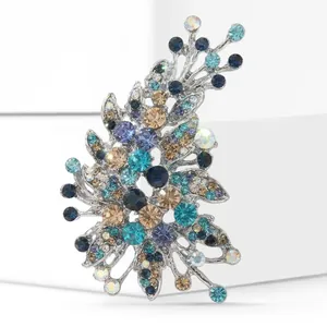 Macro view of detailed irregular glass brooch with colorful rhinestones and silver base
