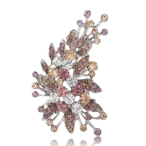 Irregular branch flower brooch with multi-colored crystals on a silver base
