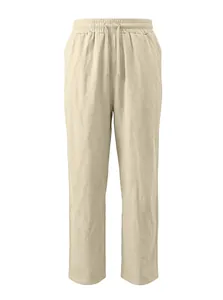 Dettaglio dei pantaloni in lino beige chiaro con vita elastica e coulisse testurizzata