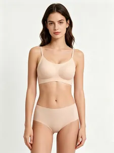 Professional front view of model wearing a seamless nude wireless bra and panty set