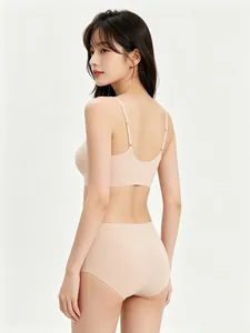 Back view of seamless nude underwear set featuring thin straps and U-neck design