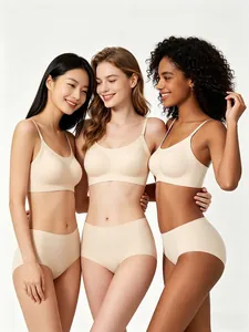Three diverse models wearing seamless beige wireless bra and panty sets together