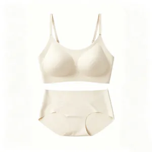 Seamless beige wireless bra and matching panty set detail view on white background