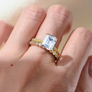 Emerald cut square zircon engagement ring set with gold band and diamond accents
