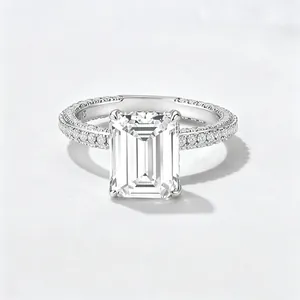 Classic 925 sterling silver emerald cut zircon ring with pave set stones on white background