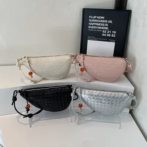 Fashionable crescent woven bags in beige, pink, black, and silver with knotted straps