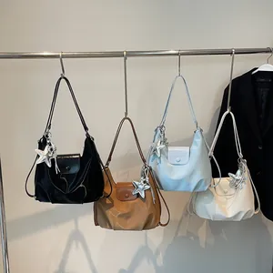 Sleek minimalist small square shoulder bags in four colors with star charm accents
