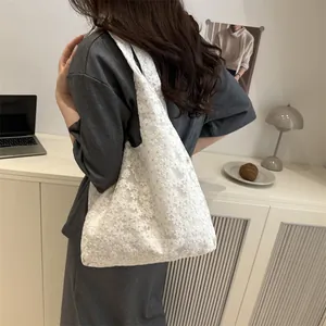 Floral daisy lace tote bag for women showing a stylish shoulder carry aesthetic
