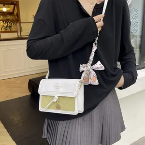 Chic color-block crossbody bag with checkered texture and decorative silk scarf bow