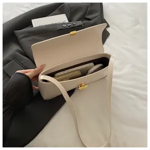 Internal view of off-white baguette bag showing capacity for phone and wallet with gold lock