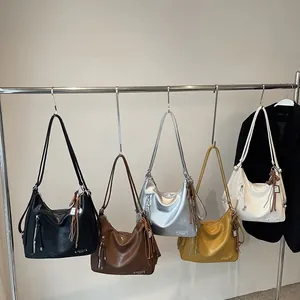 Sac fourre-tout minimaliste en cuir PU avec fermeture éclair latérale et pompon en cinq coloris