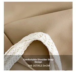 Close-up of comfortable wide crochet knit shoulder strap on beige woven tote bag