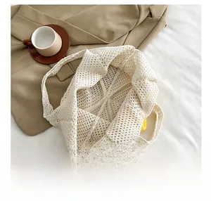Macro view of woven crochet texture and spacious interior of the beige summer tote bag