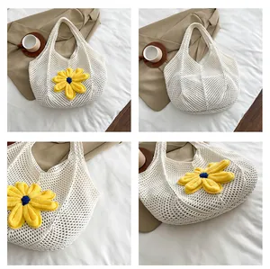 Close-up of white crochet hollow-out tote bag with 3D yellow sunflower detail