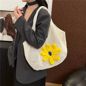 White hand-woven crochet tote bag with large sunflower detail for summer beach vacation