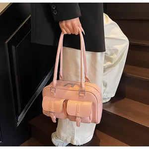 Pink glossy tote bag featuring dual front pockets and silver hardware detailing