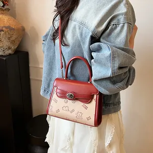 Minimalist red and white colorblock handbag with cartoon bear prints and metal twist lock