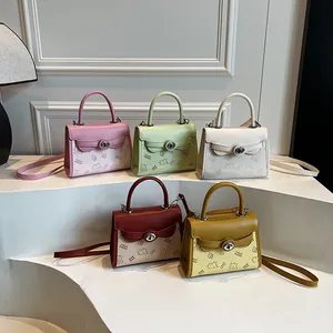 Vintage leather crossbody handbags in five colors with metal clasp and cartoon prints