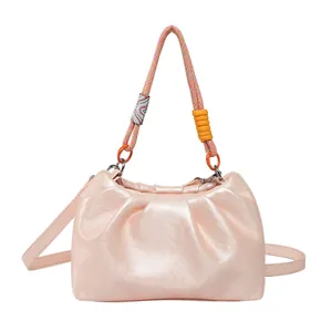 Pink pleated cloud bag with stylish tricolor woven handle and leather shoulder strap