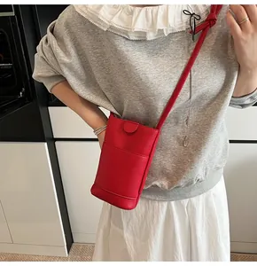 Litchi pattern red crossbody phone bag with a small front flap pocket and slim strap