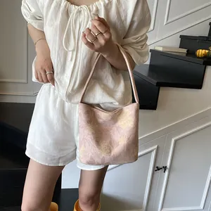 Pink floral canvas bucket bag for women with yellow flower print and top handle